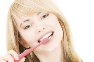 picture of happy girl with toothbrush over white