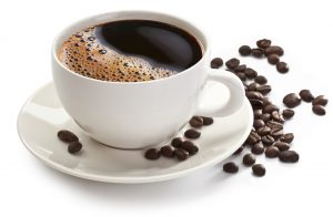 Coffee cup and beans on a white background.